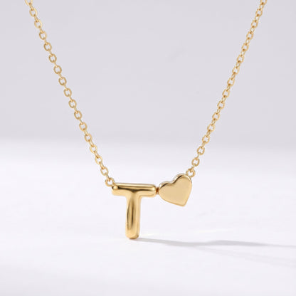 Collar letra T dorado con corazón, collar personalizado femenino en acero inoxidable resistente al agua.