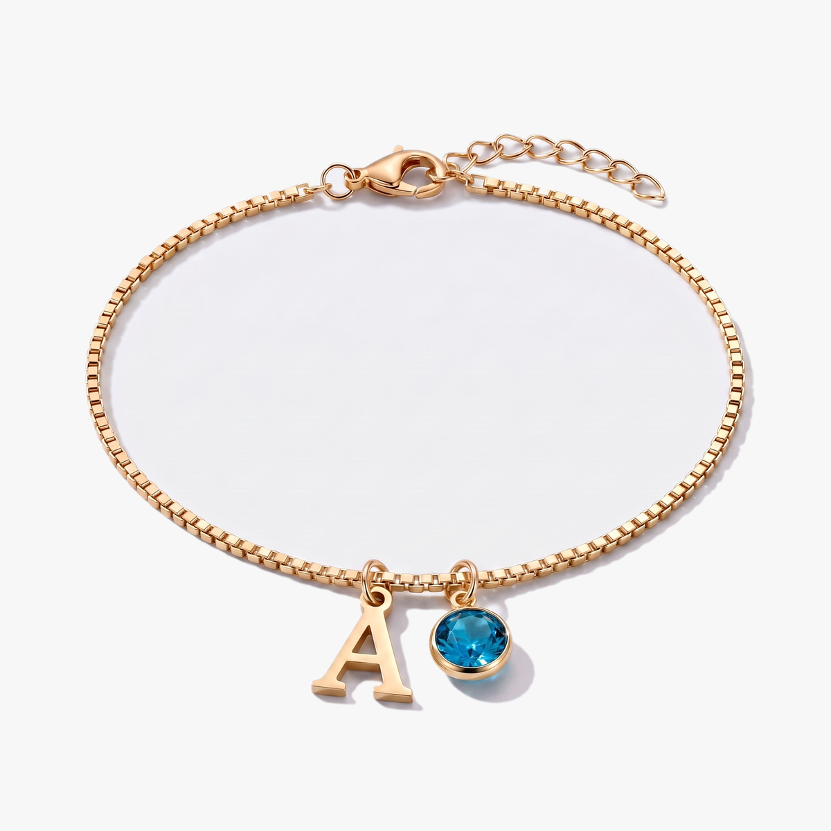 Pulsera letra A dorada con piedra de nacimiento Diciembre — Topacio azul