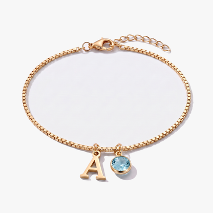 Pulsera letra A dorada con piedra de nacimiento Marzo — Aguamarina