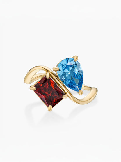 Anillo dos piedras Diciembre-Topacio azul (pera) y Enero-Granate (rectángulo) dorado
