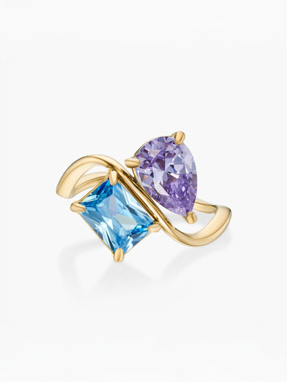 Anillo dos piedras Febrero-Amatista (pera) y Diciembre-Topacio azul (rectángulo) dorado
