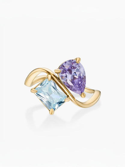 Anillo dos piedras Febrero-Amatista (pera) y Marzo-Aguamarina (rectángulo) dorado