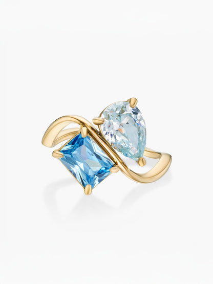 Anillo dos piedras Marzo-Aguamarina (pera) y Diciembre-Topacio azul (rectángulo) dorado