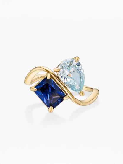 Anillo dos piedras Marzo-Aguamarina (pera) y Septiembre-Zafiro (rectángulo) dorado