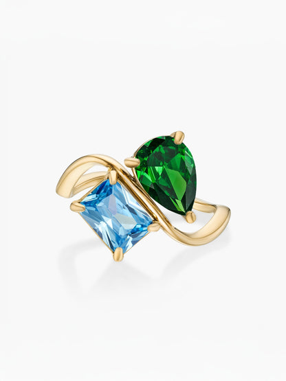 Anillo dos piedras Mayo-Esmeralda (pera) y Diciembre-Topacio azul (rectángulo) dorado