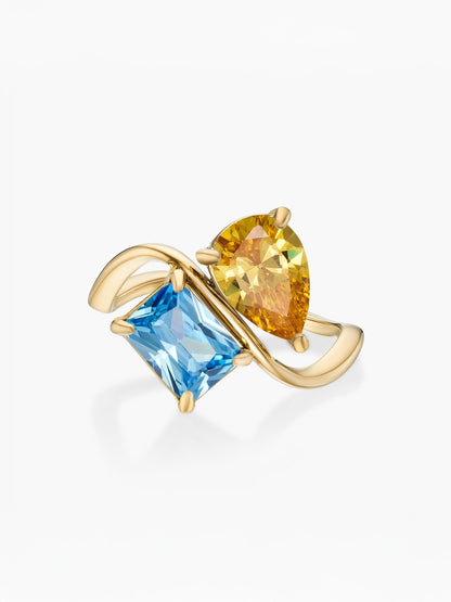 Anillo dos piedras Noviembre-Citrino (pera) y Diciembre-Topacio azul (rectángulo) dorado