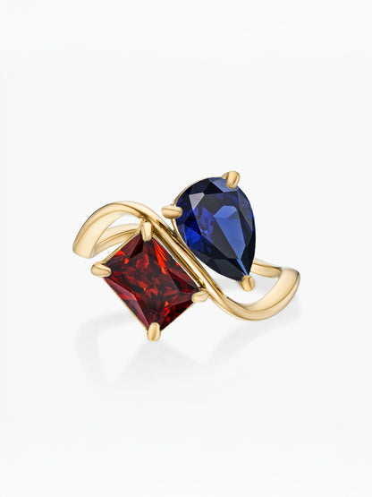 Anillo dos piedras Septiembre-Zafiro (pera) y Enero-Granate (rectángulo) dorado