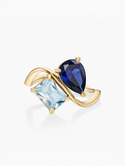 Anillo dos piedras Septiembre-Zafiro (pera) y Marzo-Aguamarina (rectángulo) dorado