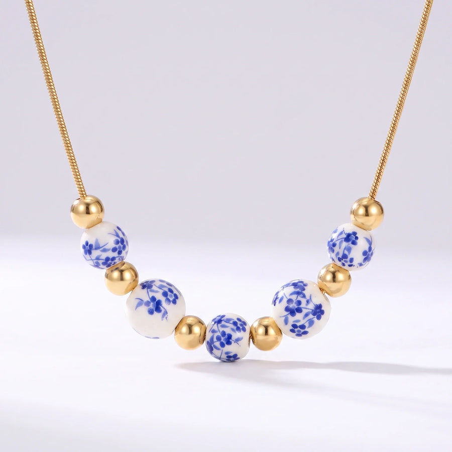 Collar de cuentas Cerámica Española de cerámica azul y blanca con esferas doradas