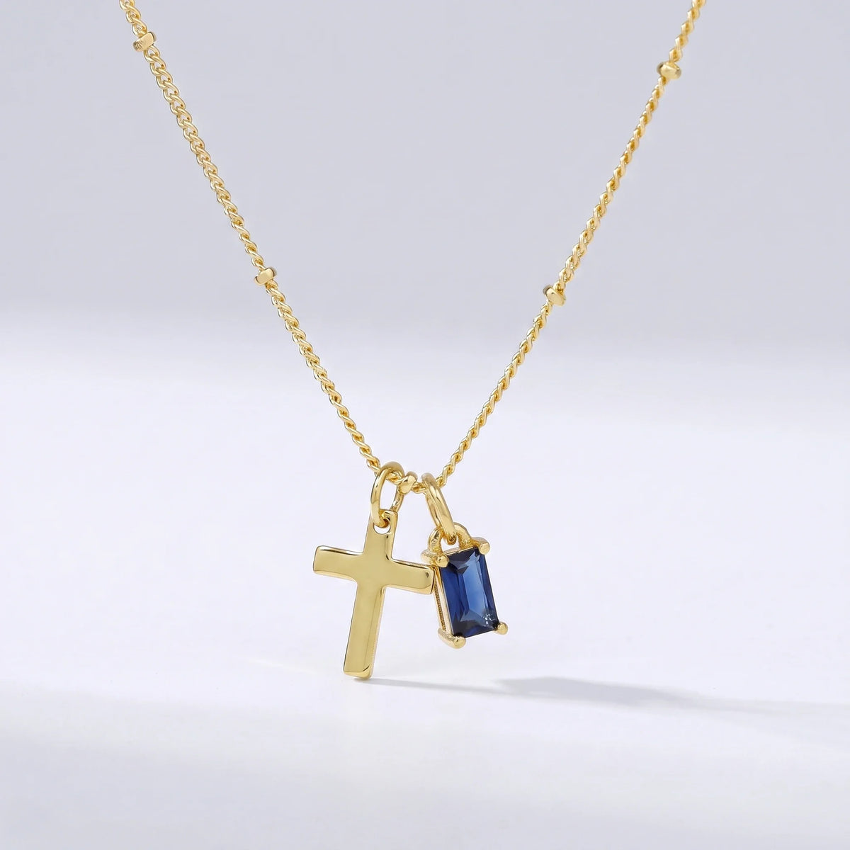 Collar cruz con piedra de nacimiento Septiembre — Zafiro
