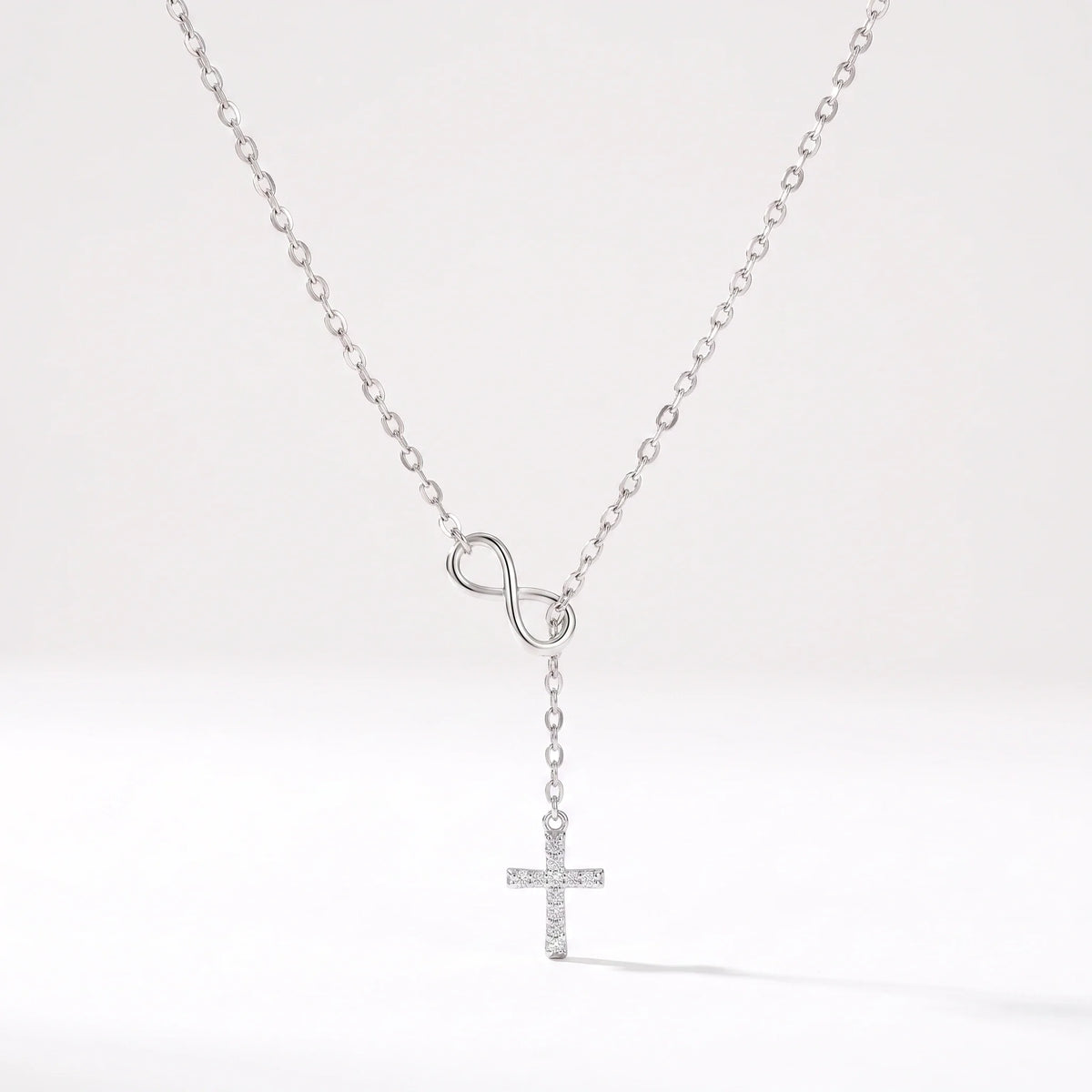 Collar Infinito y cruz Plateado