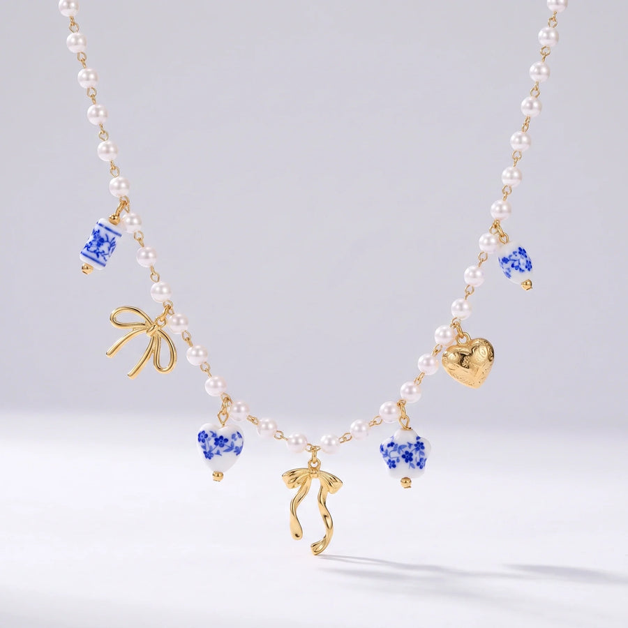 Collar de perlas con lazos dorados y cuentas de cerámica cerámica española