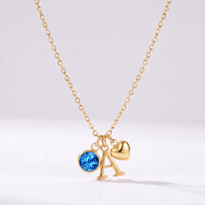 Collar letra A dorado con piedra de nacimiento Diciembre — Topacio azul y coração