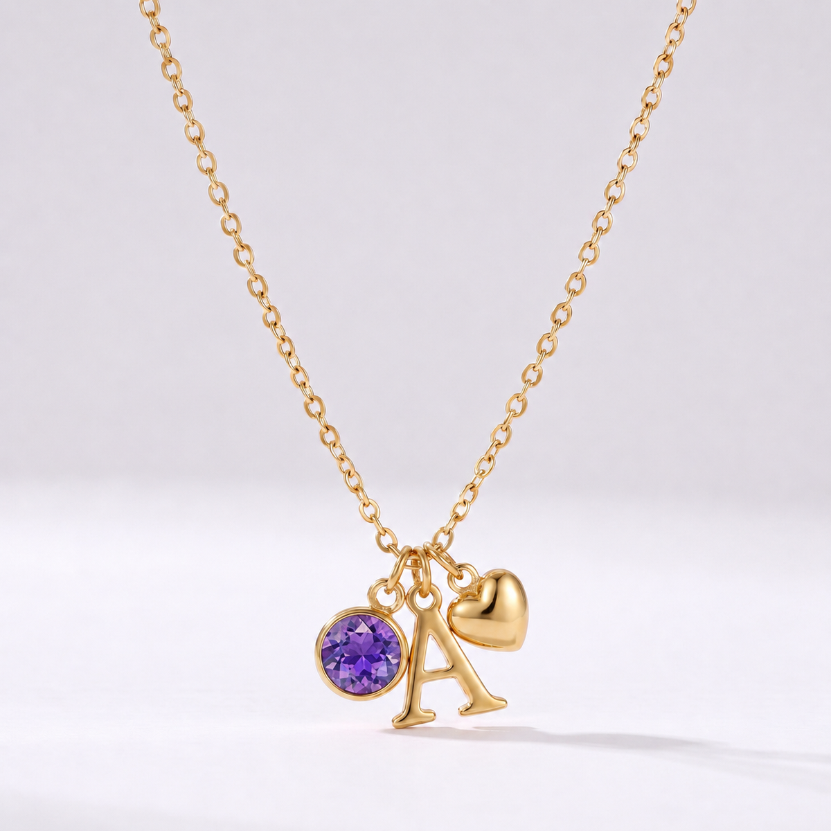 Collar letra A dorado con piedra de nacimiento Febrero — Amatista y coração