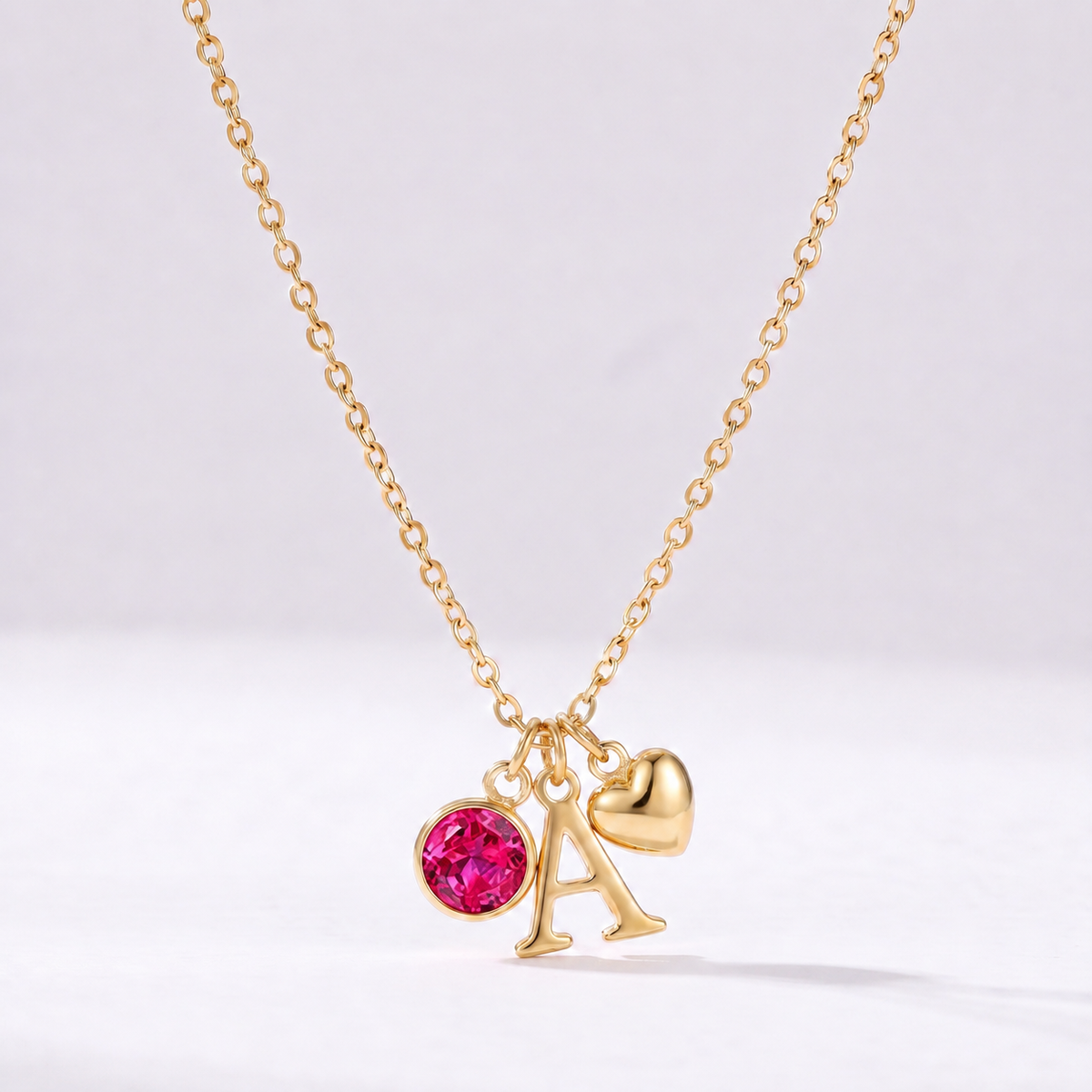 Collar letra A dorado con piedra de nacimiento Julio — Rubí y coração