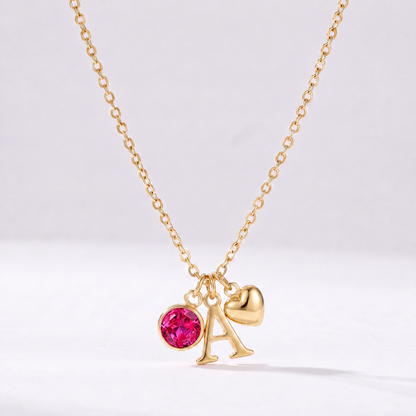 Collar letra A dorado con piedra de nacimiento Julio — Rubí y coração