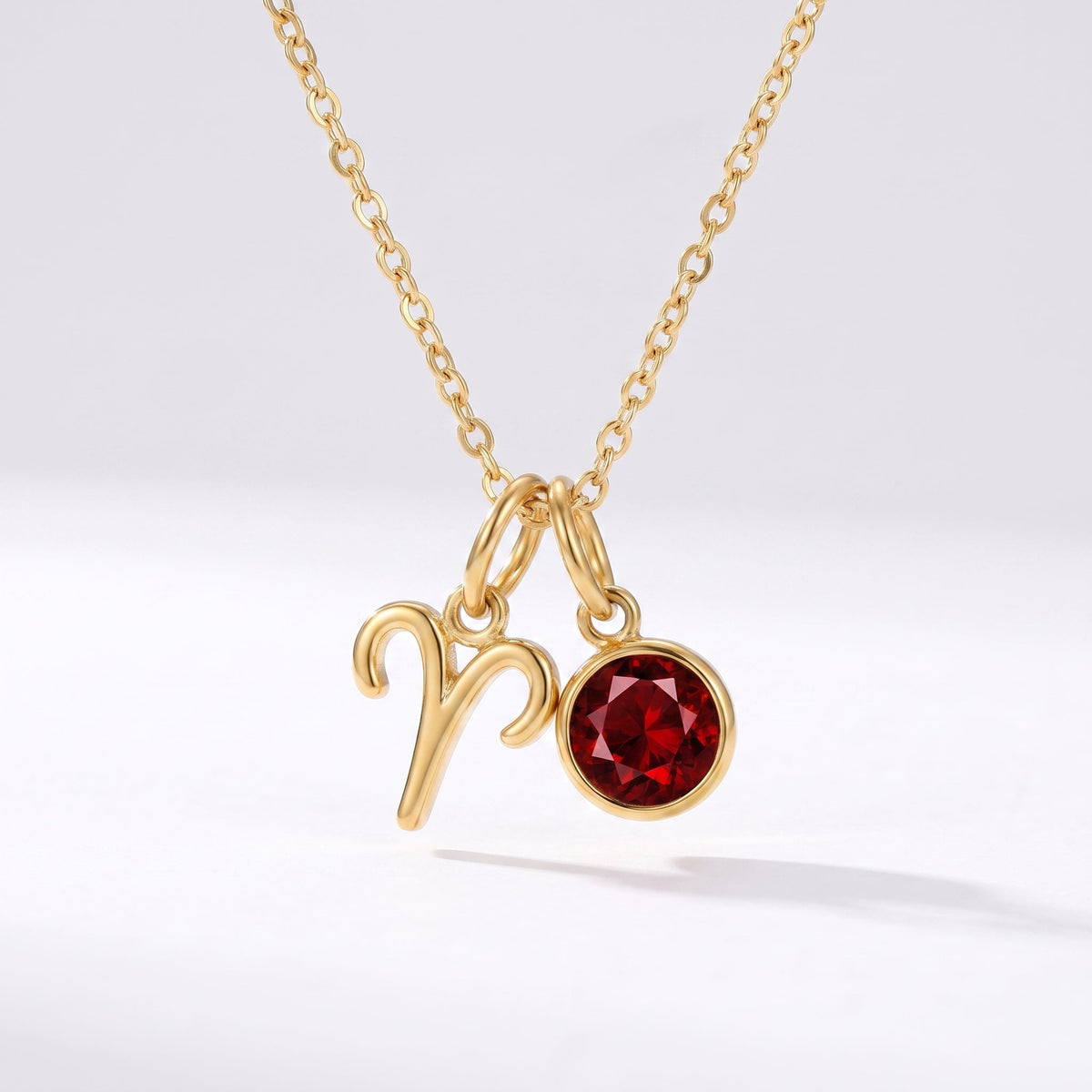 Collar signo del zodiaco Aries dorado con piedra de nacimiento Granate