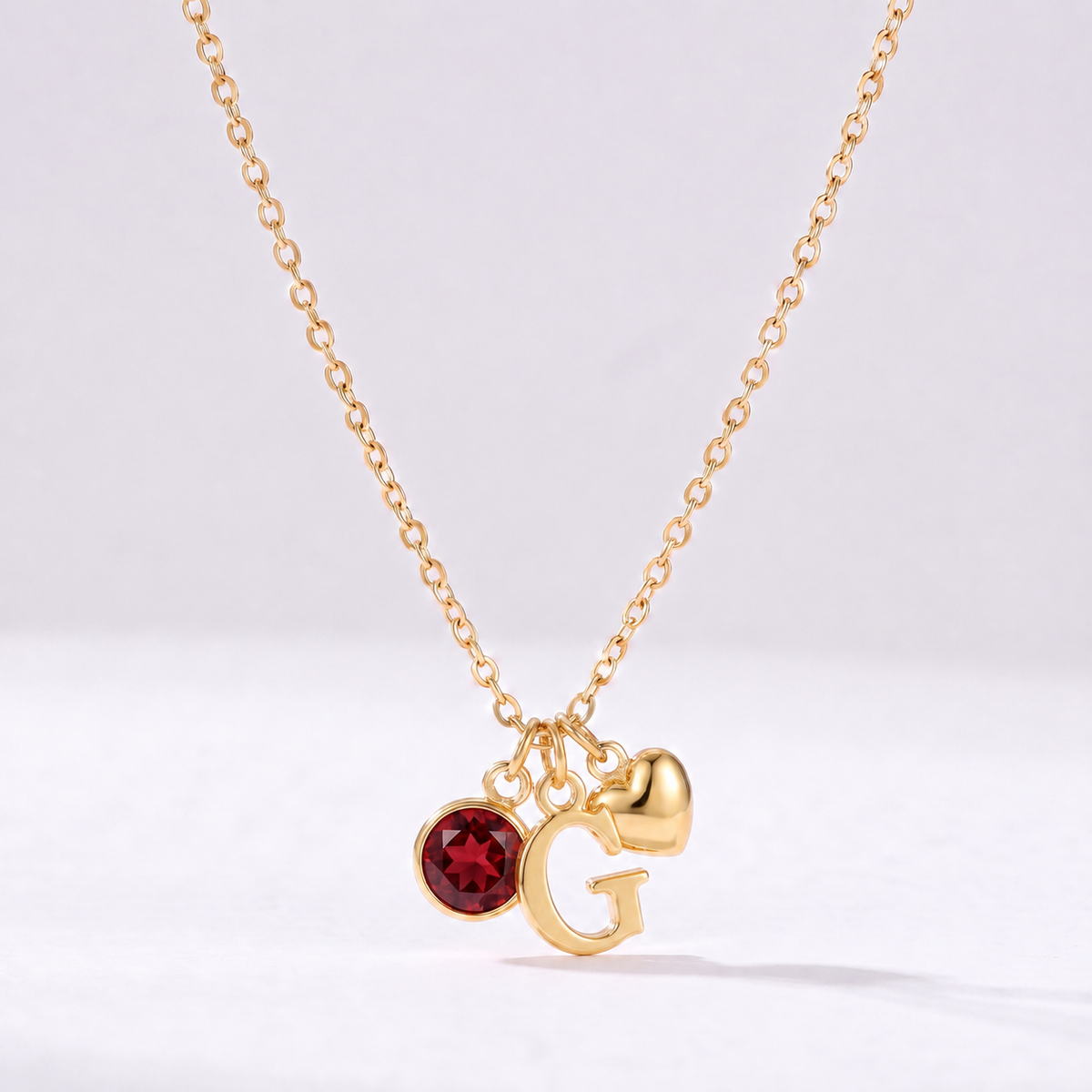 Collar letra G dorado con piedra de nacimiento y coração
