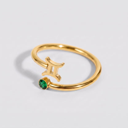 Anillo signo del zodiaco Géminis dorado con piedra Esmeralda