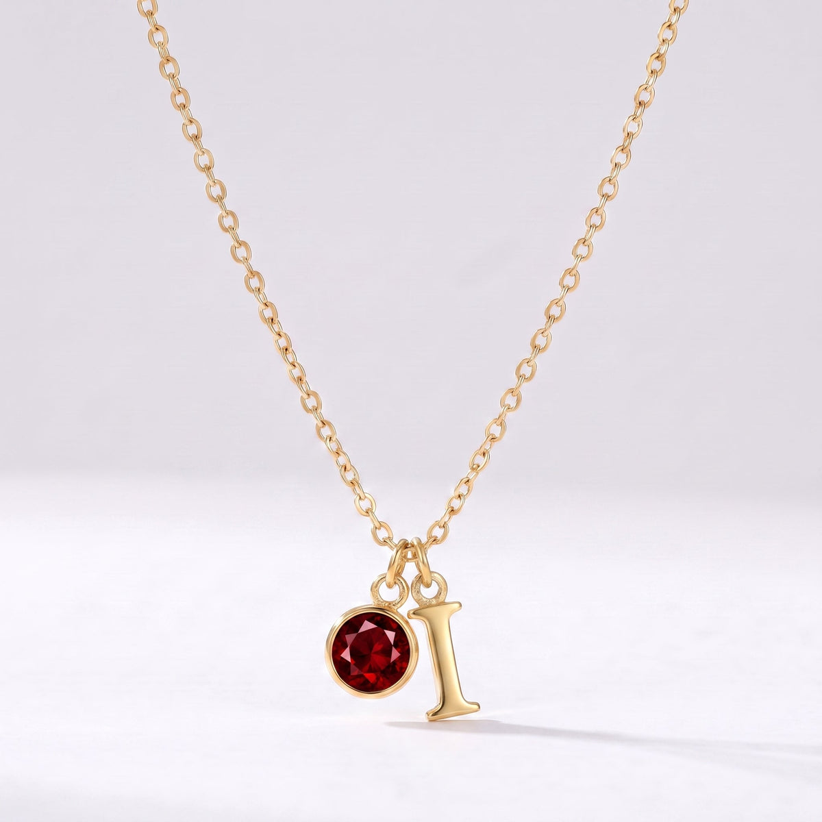Collar letra I dorado con piedra de nacimiento