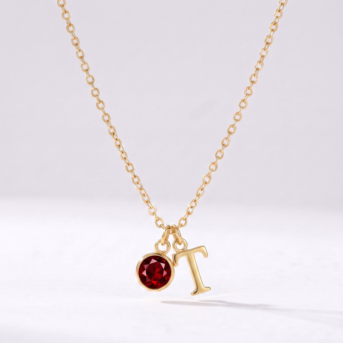 Collar letra T dorado con piedra de nacimiento
