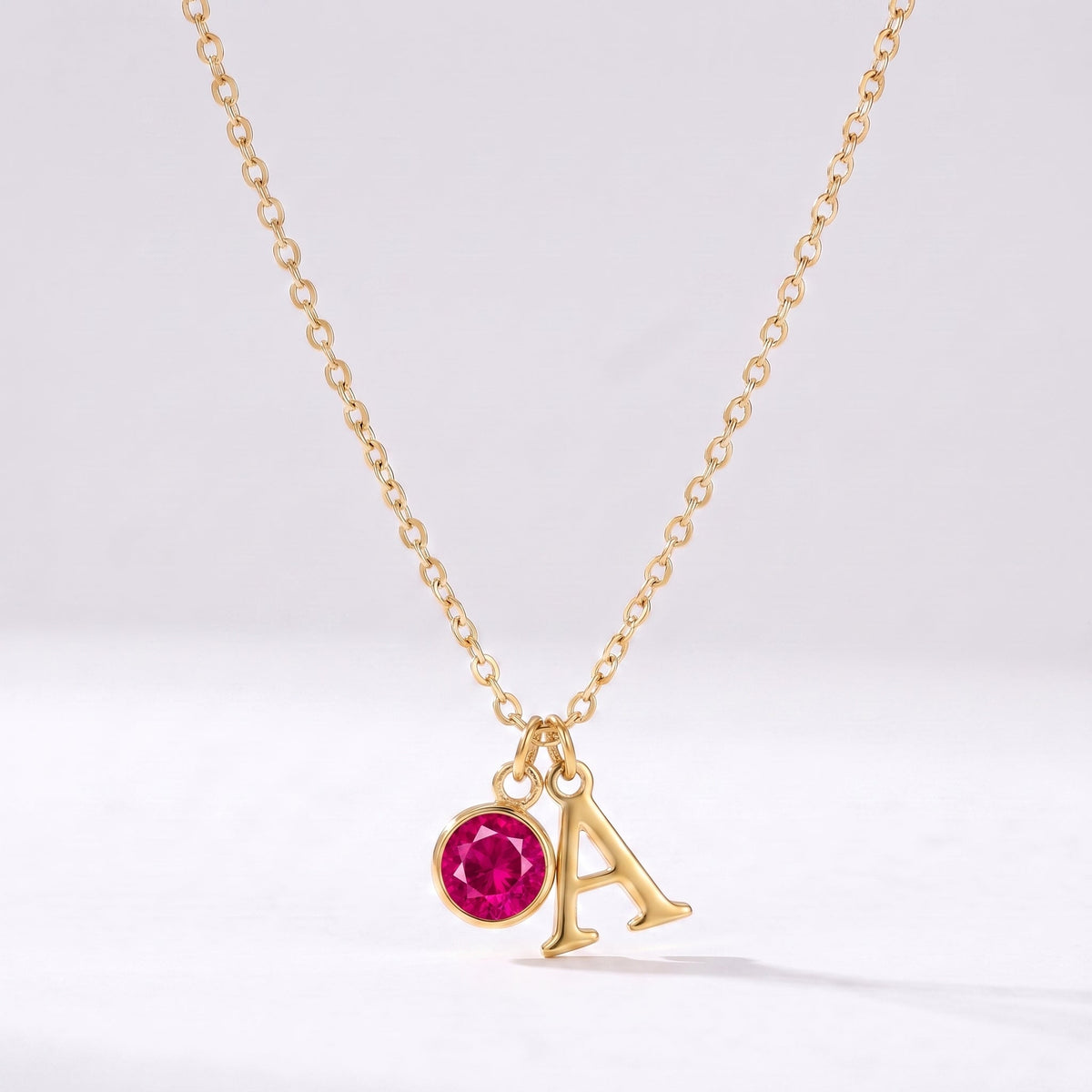 Collar letra A dorado con piedra de nacimiento Julio — Rubí