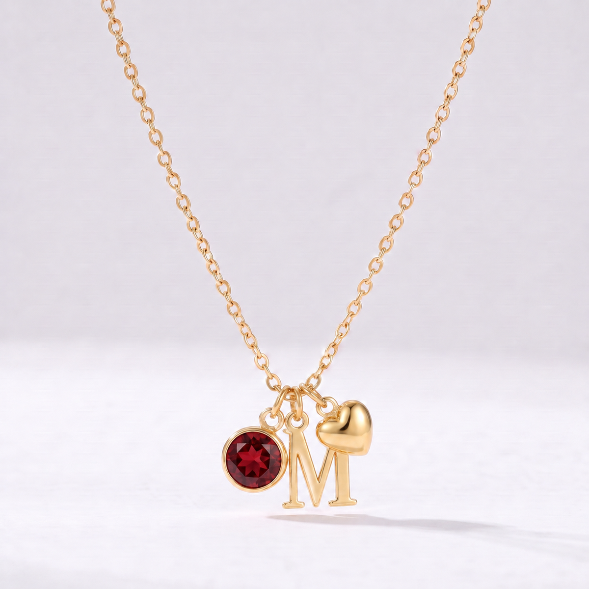 Collar letra M dorado con piedra de nacimiento y coração