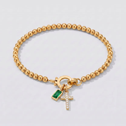 Pulsera dorada de cuentas con cruz y piedra de nacimiento esmeralda verde de mayo.