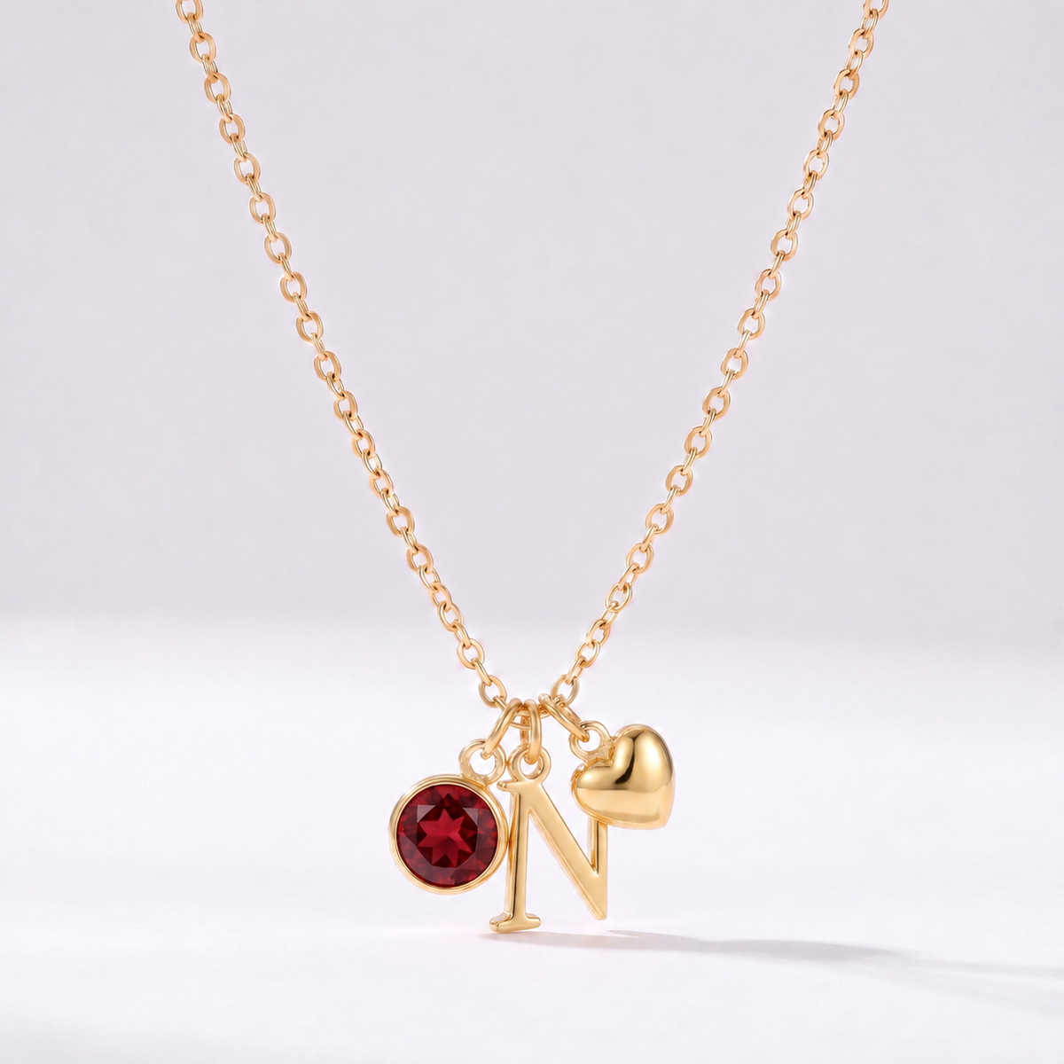Collar letra N dorado con piedra de nacimiento y coração