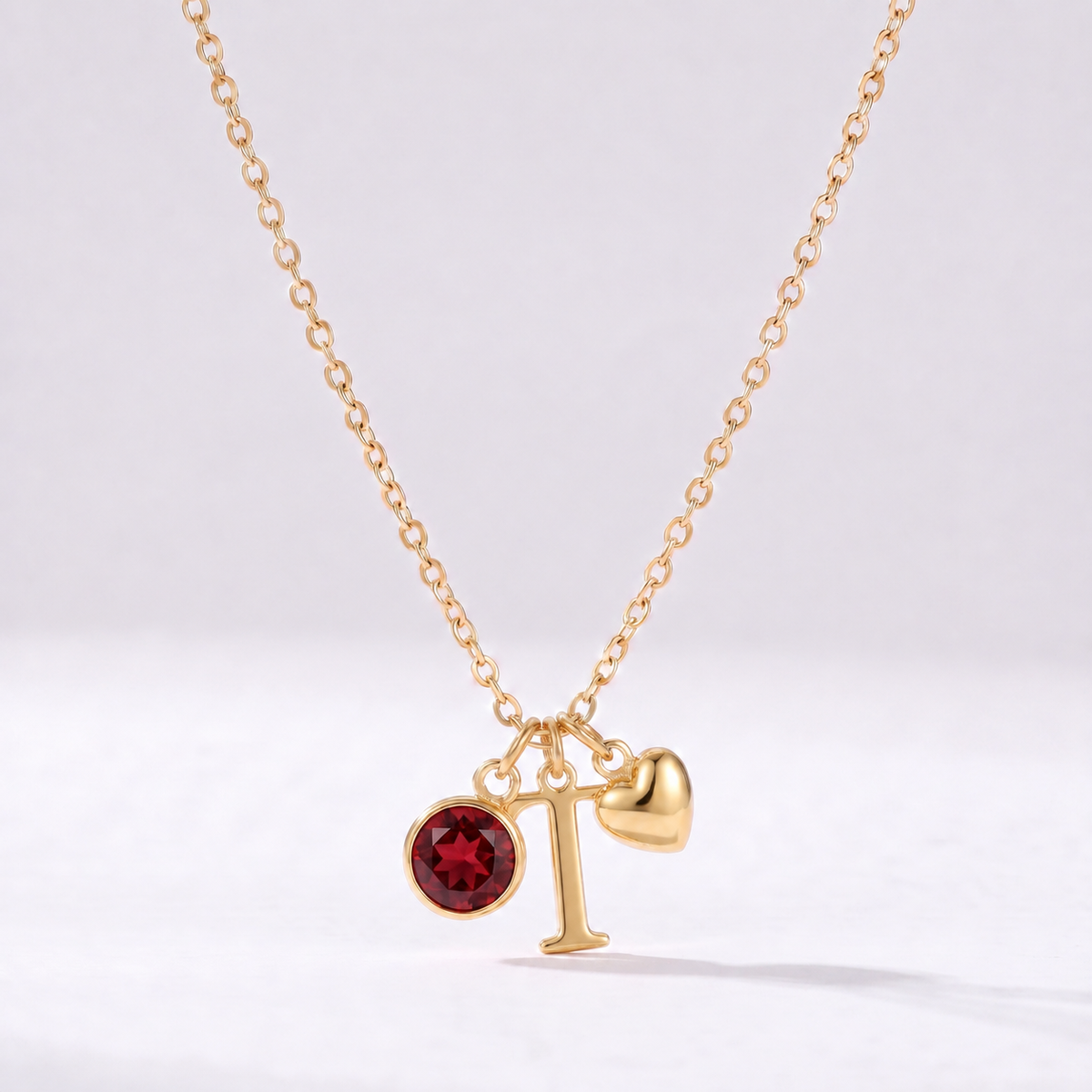 Collar letra T dorado con piedra de nacimiento y coração