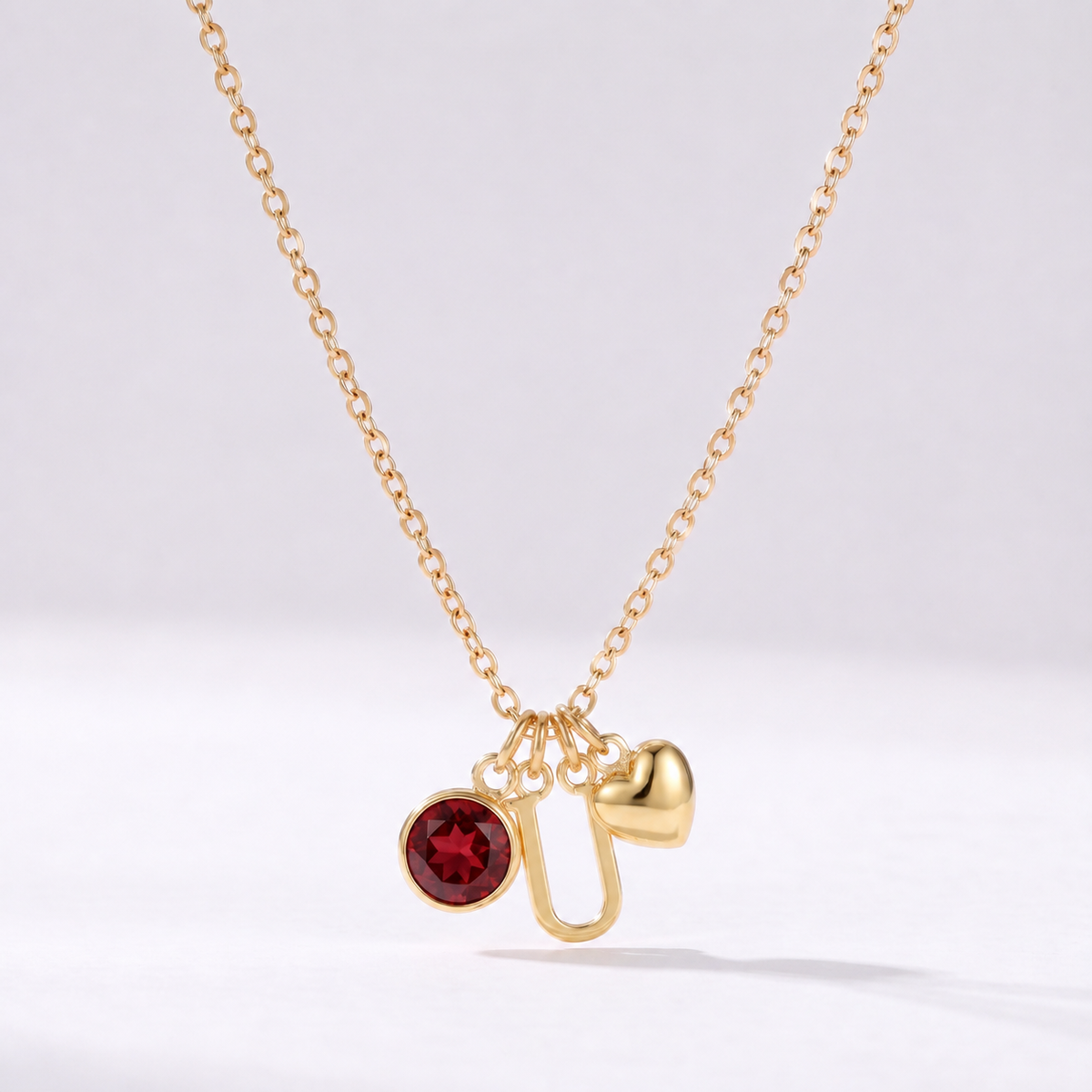 Collar letra U dorado con piedra de nacimiento y coração