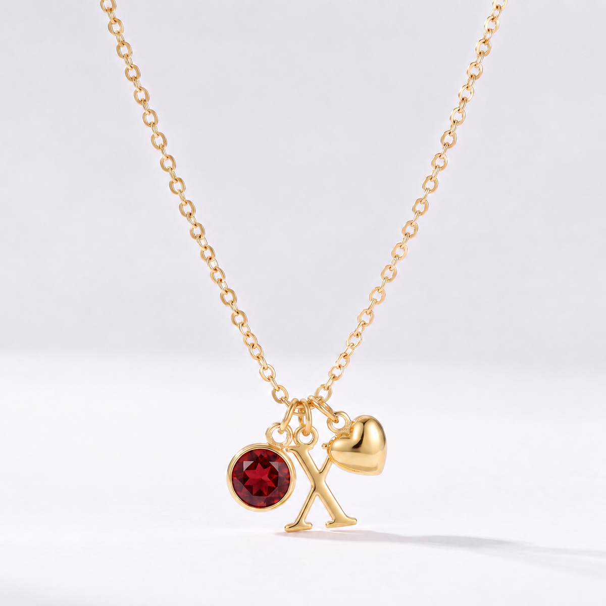 Collar letra X dorado con piedra de nacimiento y coração