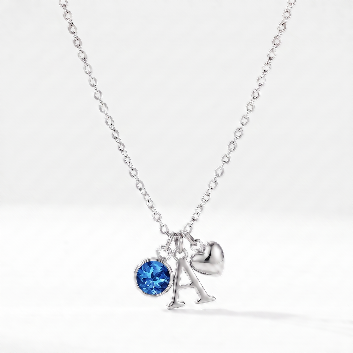 Collar letra A plateado con piedra de nacimiento Diciembre — Topacio azul y coração