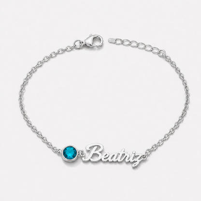 Pulsera con nombre y piedra de nacimiento plateada — Diciembre — Topacio azul, nombre Beatriz
