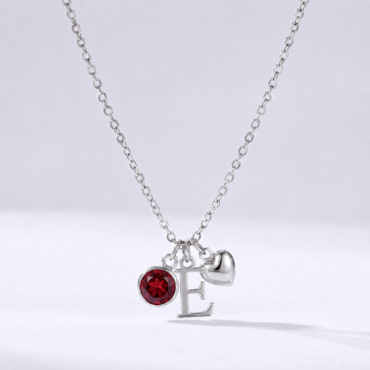Collar letra E plateado con piedra de nacimiento y coração