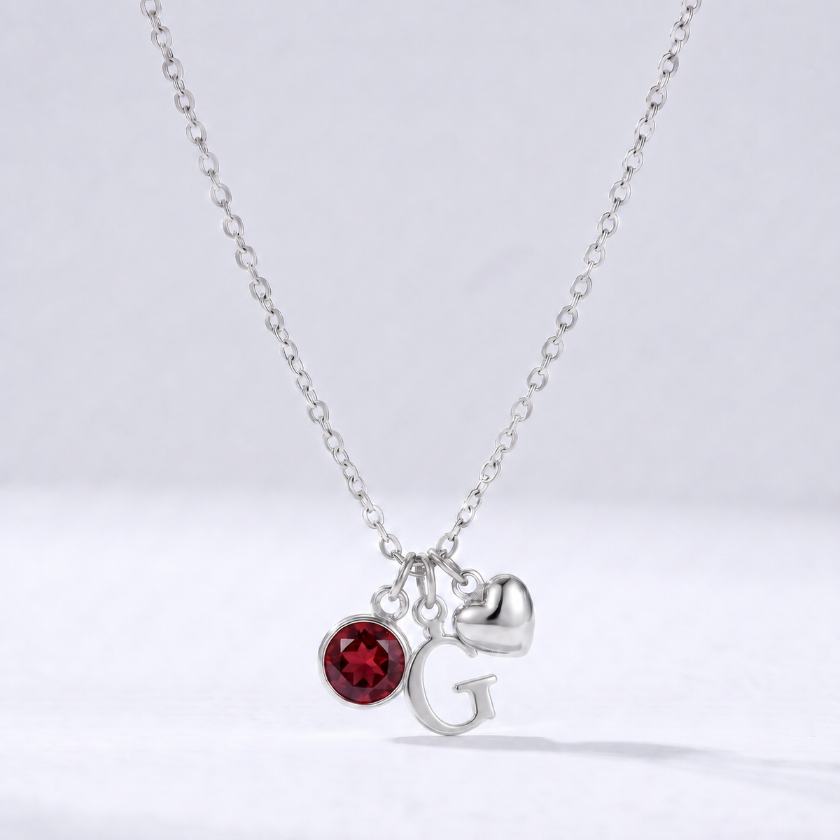 Collar letra G plateado con piedra de nacimiento y coração