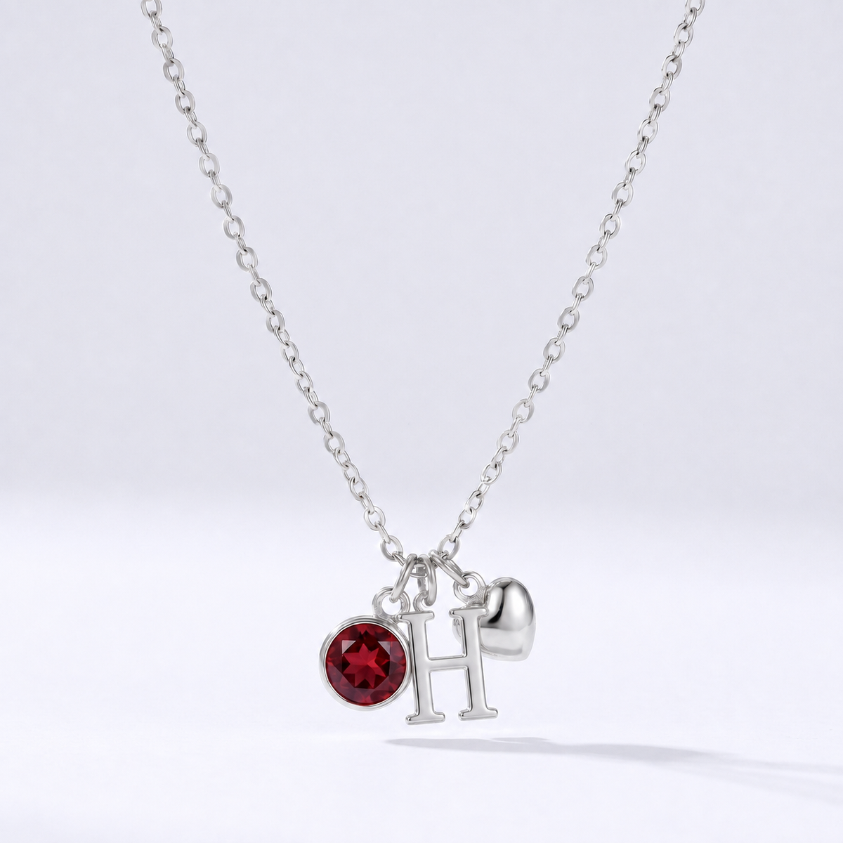 Collar letra H plateado con piedra de nacimiento y coração