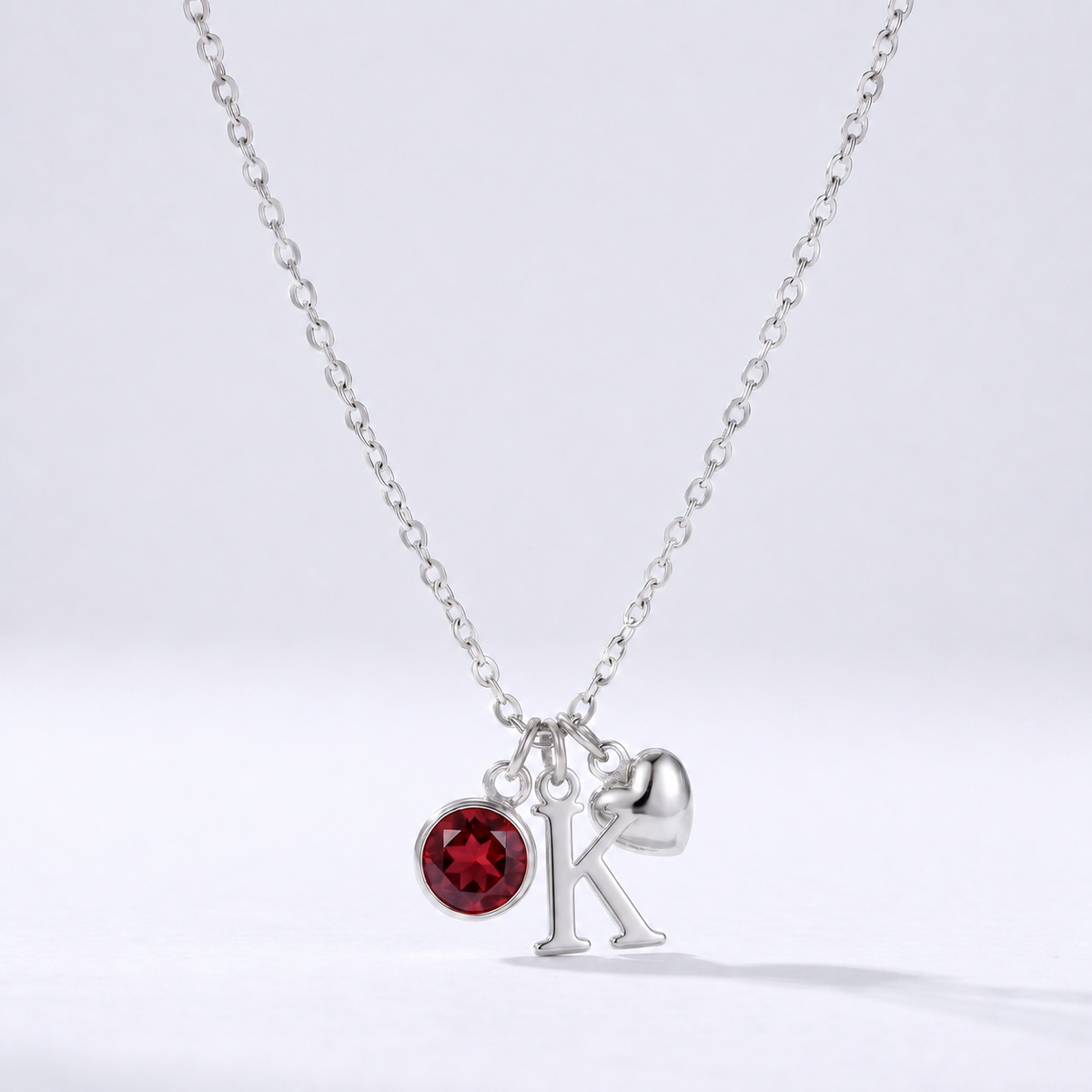 Collar letra K plateado con piedra de nacimiento y coração