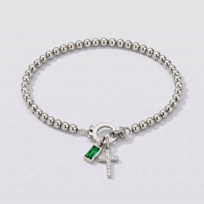Pulsera plateada de cuentas con cruz y piedra de nacimiento esmeralda verde de mayo.