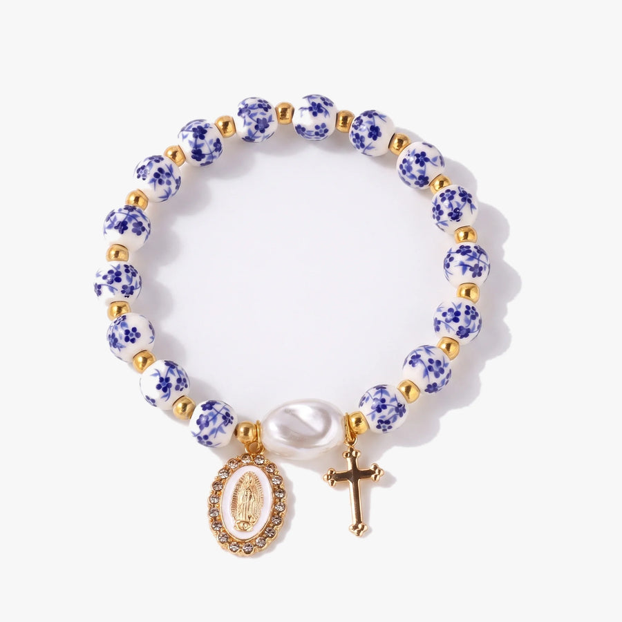 Pulsera cerámica española con medalla de la Virgen María, cruz y perla