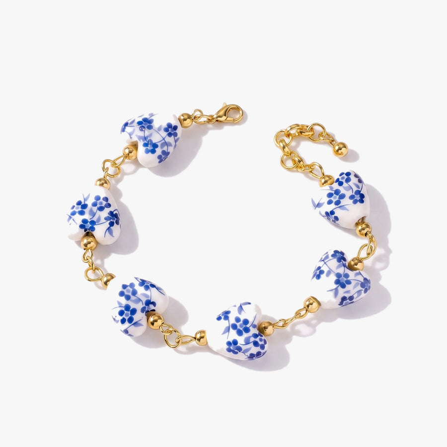 Pulsera corazón cerámica española — seis corazones de cerámica azul y blanca