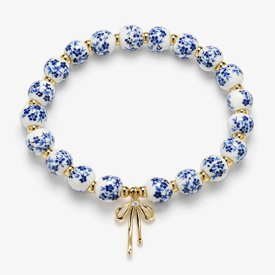 Pulsera Lazo de Cerámica de cerámica azul y blanca con detalles dorados